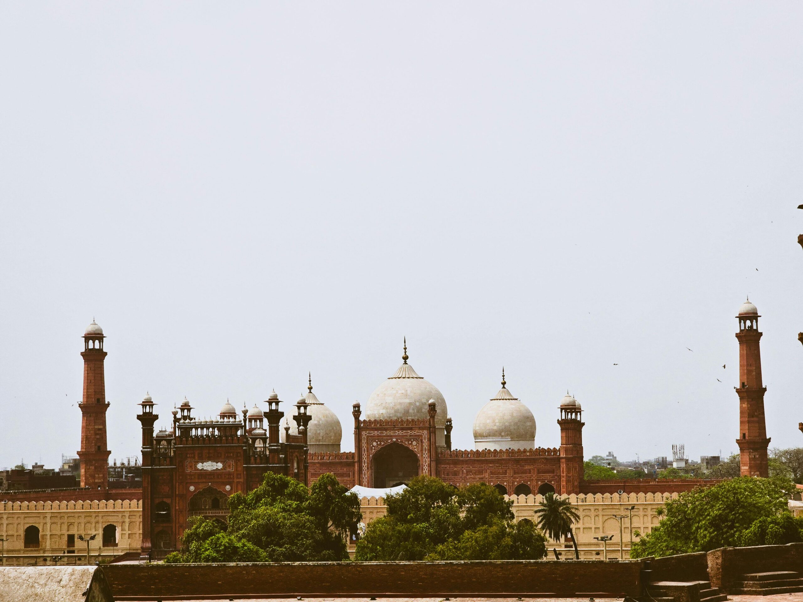 An iconic view of the Badshahi Mosque in Lahore, showcasing its stunning Mughal architecture.